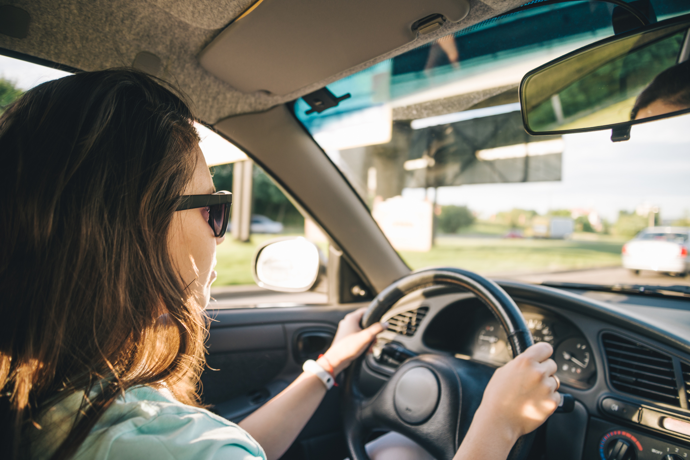 young woman driving car